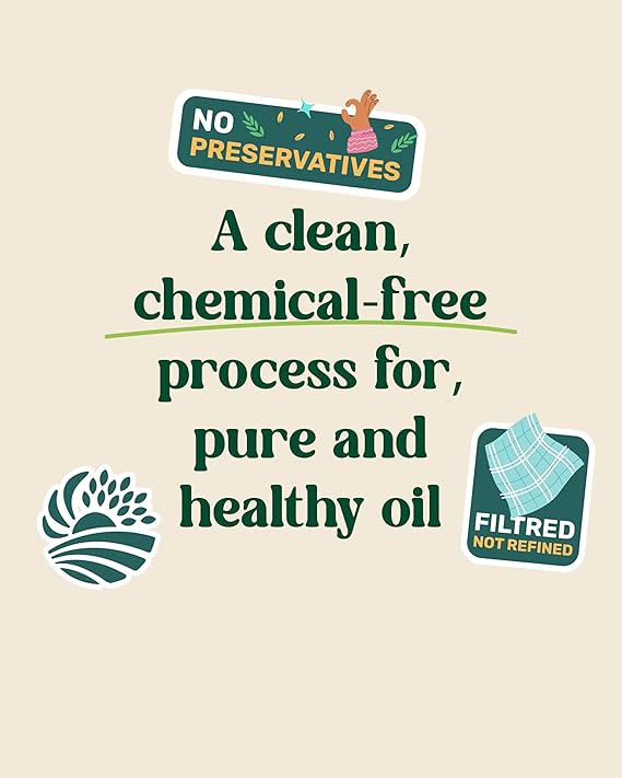 Amrutva Cold Pressed Groundnut Oil - A bottle of groundnut oil beside a bowl of peanuts.