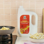 frying fries in kitchen setup with groundnut oil filtered 5 liter pack