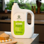 bottle of 5 liter sesame oil cold pressed filtered oil in kitchen setup by amrutva fine foods llp