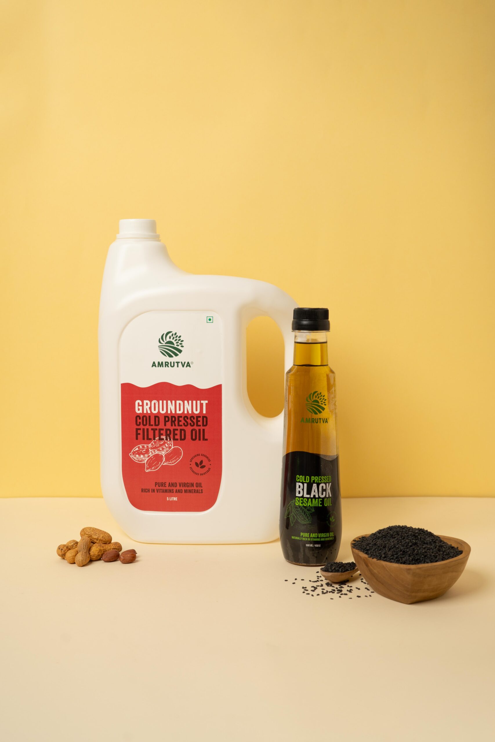 Amrutva Cold Pressed Groundnut and Sesame Oil Combo. This image showcases a combo pack featuring cold pressed groundnut oil and black sesame seed oil; ideal for healthy cooking and other uses.