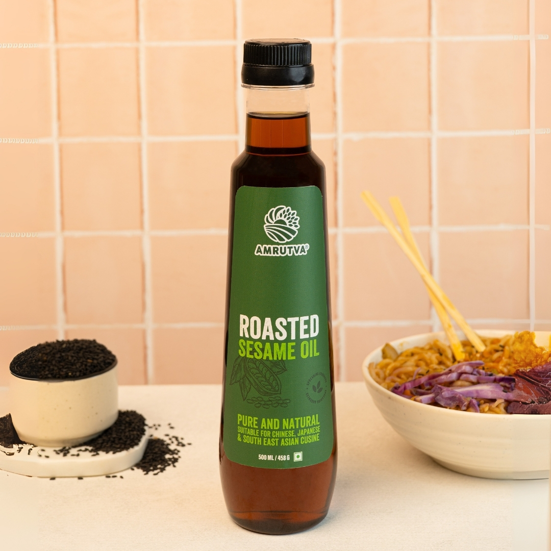 Roasted sesame oil 500 ml with kitchen background having salad dressing use case shown