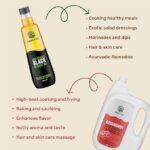 Amrutva Cold Pressed Groundnut and Sesame Oil Combo. This image showcases a combo pack featuring cold pressed groundnut oil and black sesame seed oil; ideal for healthy cooking and other uses.
