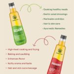 Amrutva Cold Pressed Groundnut and Sesame Oil Combo. This image shows two bottles of cold pressed oil; one groundnut and one sesame; alongside raw ingredients.
