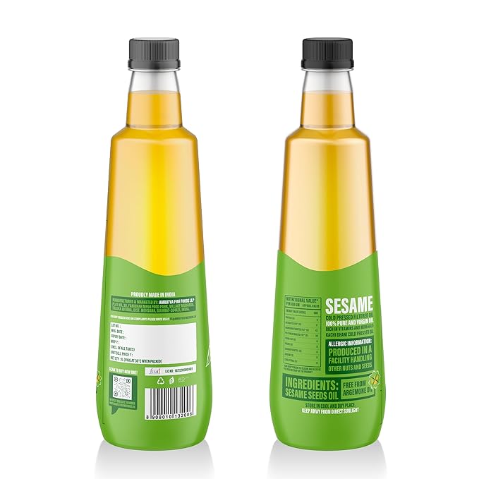 Amrutva Cold Pressed Groundnut and Sesame Oil Combo. This image shows two bottles of cold pressed oil; one groundnut and one sesame; alongside raw ingredients.