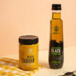 Amrutva Cold Pressed Black Sesame Oil and Black Tahini Combo. Perfect for cooking and adding a rich; nutty flavor to your dishes. This organic cold pressed sesame oil is a healthy and delicious choice.
