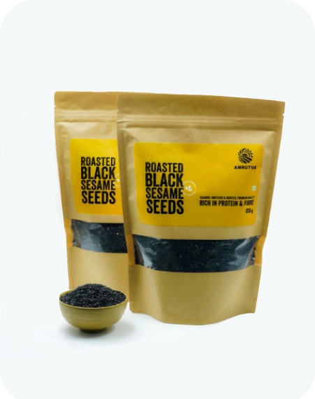 Roasted black sesame seeds in a bowl and package. These black sesame seeds are a good source of essential minerals and perfect for adding flavor to various dishes.
